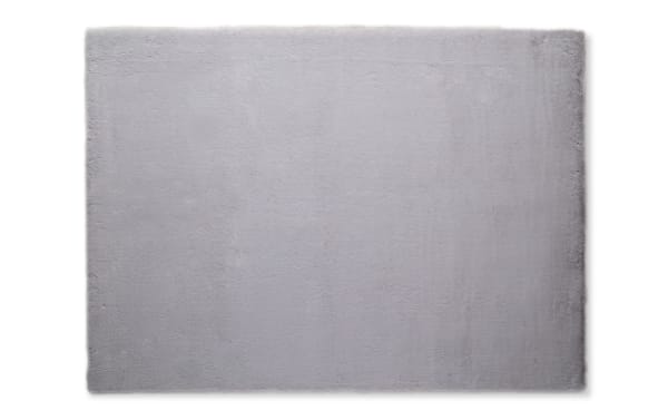 Soft, plush light gray area rug with a smooth, even texture, ideal for modern living room or bedroom decor.