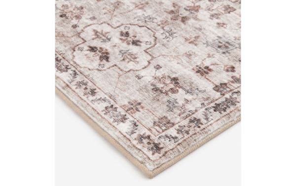 Beige Gia 8' x 10' vintage transitional rug with floral motifs, made of cushy polyester fabric and Bob-O-Pedic Memory Foam padding.