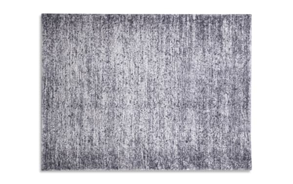 Gray abstract transitional 5' x 7' Angora rug with soft polyester fabric and charcoal Bob-O-Pedic memory foam backing for cushioned comfort.