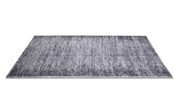 Angora 5' x 7' Gray Abstract Rug with a transitional style, featuring a gray polyester fabric surface and plush charcoal Bob-O-Pedic memory foam backing for comfort and odor control.
