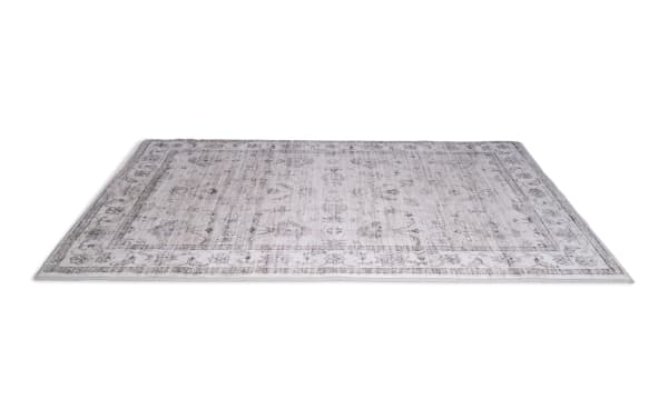 Beige Everly 5' x 7' transitional Oriental rug with subtle floral pattern, made of polyester fabric and charcoal-infused memory foam layer for freshness.