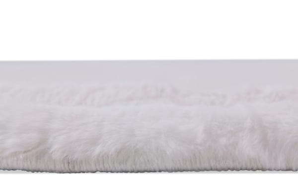Close-up of the Sofia Channel 8' x 10' white solid transitional rug showing its silky soft polyester fabric surface with plush Bob-O-Pedic memory foam cushioning.