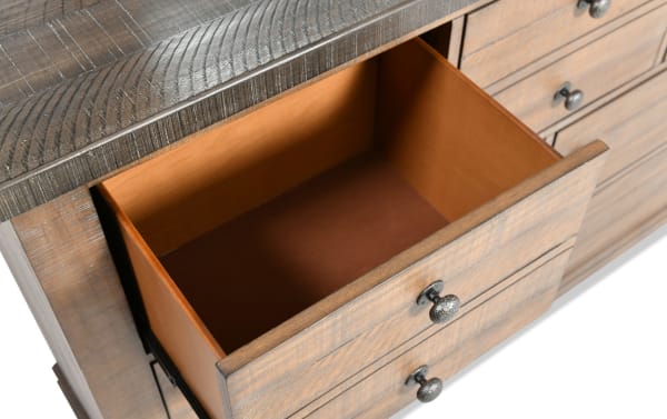 Open drawer of Beaumont Brown & Gray 7 Drawer Dresser showing pine solid and veneer construction, traditional style, and metal knob handles.