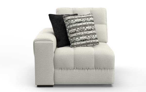 Modern beige fabric sectional sofa corner piece with tufted cushions, wide armrest, and two decorative throw pillows in black and patterned gray.