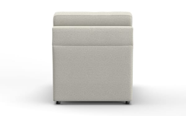 Beige fabric upholstered ottoman with a cushioned top and short black legs, designed for modern living room seating or footrest.