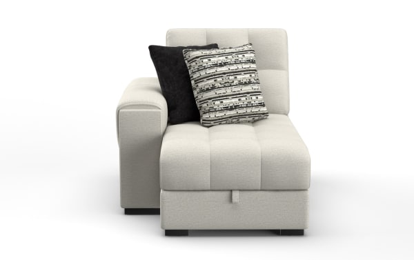 Modern beige fabric chaise lounge with tufted cushions, left armrest, and two decorative pillows in black and patterned gray tones, ideal for living room seating.