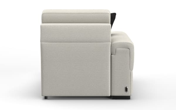Side view of a modern beige fabric recliner sofa with cushioned armrest, black power recline button, and low black legs.