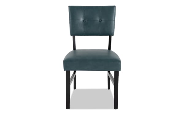 Teal faux leather upholstered dining chair from Bettie Dining collection, mid-century modern style with panel back and memory foam seat.