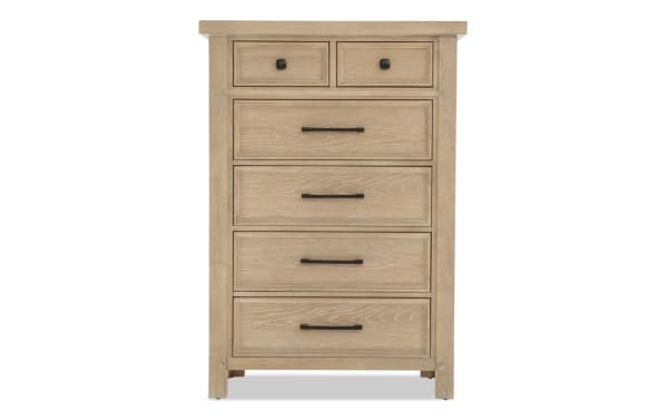 Wooden chest of drawers with a light oak finish, featuring two small top drawers with black knobs and four larger drawers with black horizontal handles, suitable for bedroom storage.