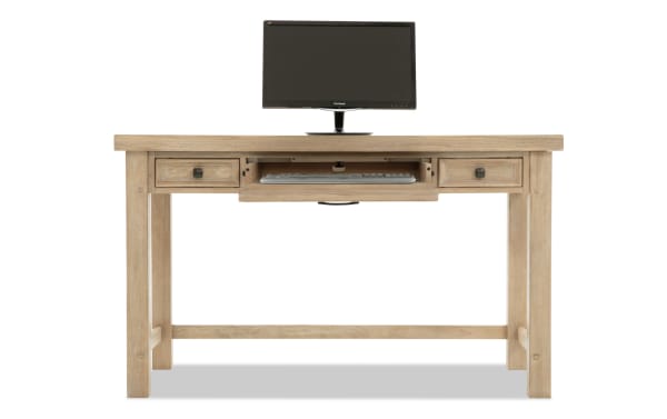 Wooden computer desk with a natural finish, featuring two side drawers and a central pull-out keyboard tray, topped with a ViewSonic monitor.