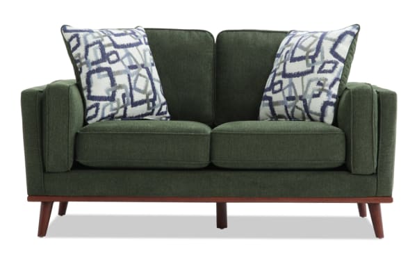 Tribeca Green 66'' Loveseat in mid-century modern style with green polyester fabric upholstery, tapered wooden legs, and patterned accent pillows.
