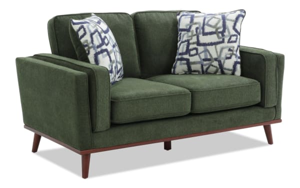 Tribeca Green 66'' Loveseat in mid-century modern style with green polyester fabric upholstery, wooden legs, and patterned accent pillows for comfort.