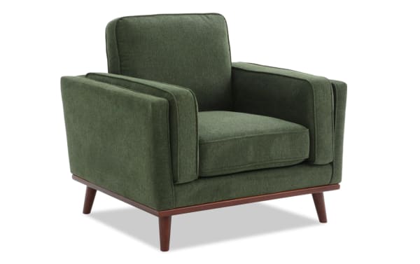 Mid-century modern Tribeca Green Chair with green polyester fabric upholstery, memory foam cushion, and wooden tapered legs for stylish comfort.