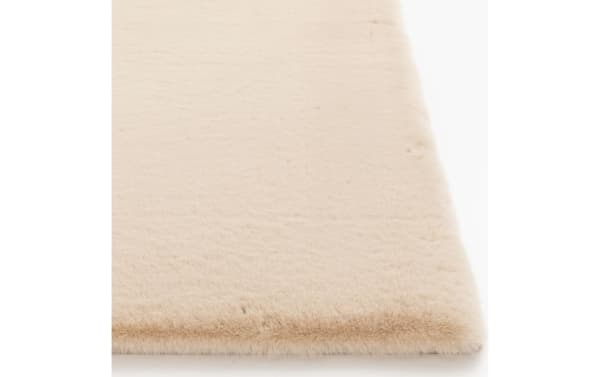 Beige Simba Luxe 8' x 10' transitional rug with high-pile polyester fabric, soft texture, and solid color for cozy, stylish flooring.