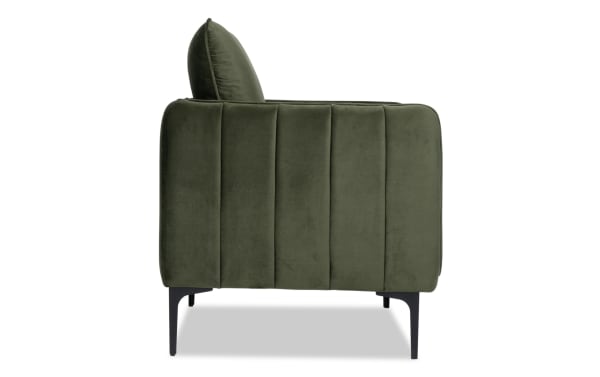 Contemporary Madeline Olive Green Accent Chair with plush velvet upholstery, vertical channel tufting, slope arms, and black metal legs for stylish comfort.