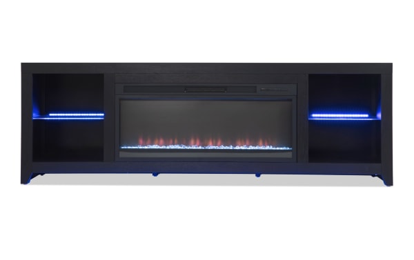 Cosmopolitan 85'' black contemporary electric fireplace and TV stand with MDF, tempered glass, LED multi-color lights, adjustable thermostat, and storage shelves.