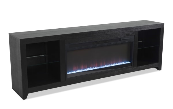 Cosmopolitan 85'' black contemporary electric fireplace and TV stand with MDF, tempered glass, adjustable thermostat, LED flames, multi-color lights, and storage shelves. Fully assembled from the Cosmopolitan Entertainment Occasional collection.
