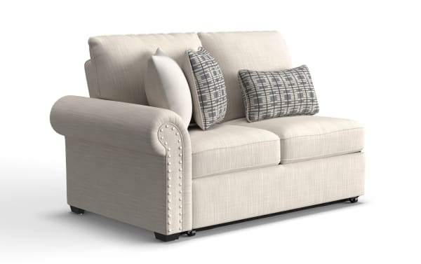 Playlist Max Beige Left Arm Facing Pop-Up Sleeper Loveseat in traditional beige polyester fabric with nailhead trim and patterned accent pillows, featuring built-in USB and USB-C charging ports.