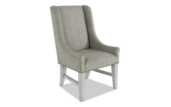 Beaumont White & Beige Solid Back Upholstered Dining Chair with beige polyester fabric, nailhead trim, and pine wood legs, transitional style.