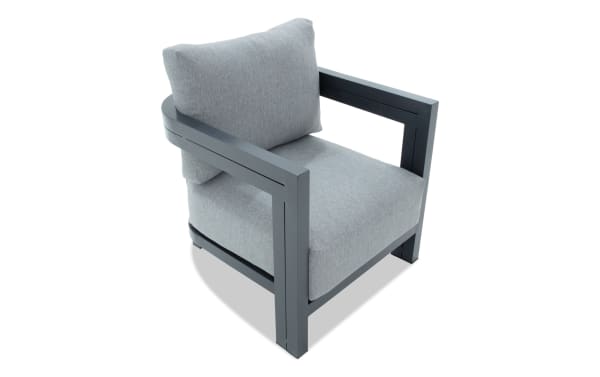 Modern gray fabric armchair with thick cushions and dark gray metal frame, featuring straight armrests and a minimalist design.