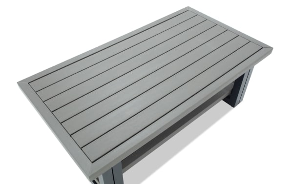 Rectangular outdoor coffee table with gray composite wood slats and sturdy dark gray metal legs, modern patio furniture design.