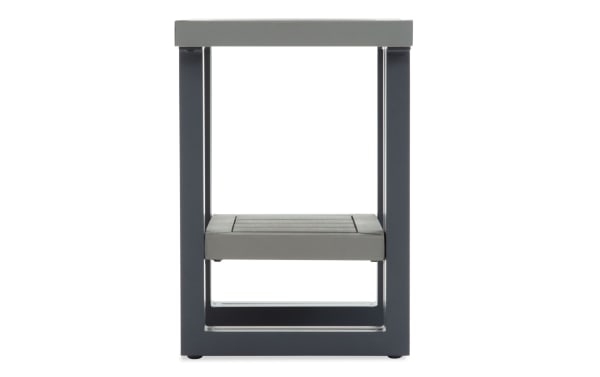 Modern side table with a gray composite wood top and shelf, supported by a dark gray metal frame, suitable for indoor or outdoor use.