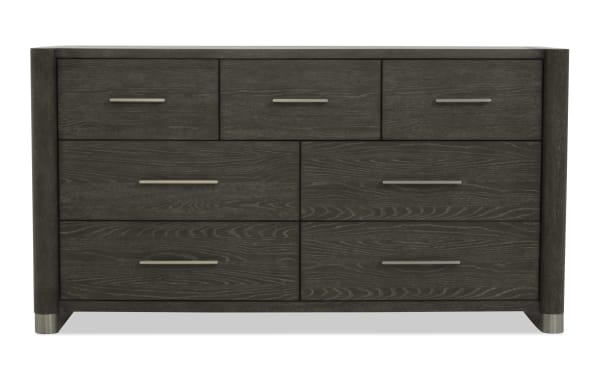 Dark gray wooden dresser with six drawers, sleek silver handles, modern design, and metal-capped legs, suitable for bedroom storage.