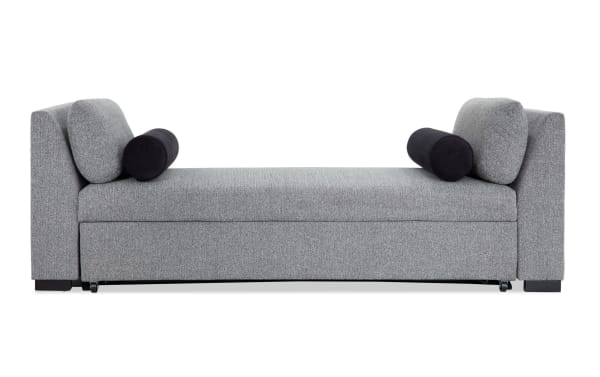 Transitional gray fabric polyester Daydreamer daybed with pop-up sleeper, memory foam cushioning, and padded armrests for versatile lounging and sleeping.
