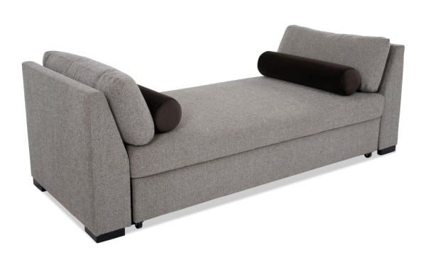 Transitional brown Daydreamer daybed with polyester fabric upholstery, featuring tapered arms, plush back cushions, and a pop-up sleeper with memory foam for versatile lounging and sleeping.