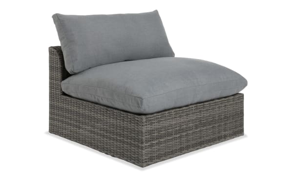 Dream Gray Wicker Outdoor Armless Chair with deep seating, gray all-weather wicker, powder-coated aluminum frame, and reversible polyester cushions.