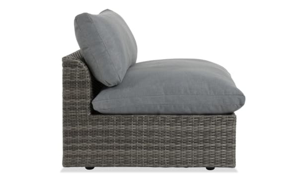 Dream Gray Wicker Outdoor Armless Chair from Dream Outdoor collection with gray all-weather wicker, aluminum frame, and plush reversible polyester cushions.