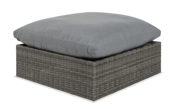Dream Gray Wicker Outdoor Ottoman with reversible gray polyester cushion, all-weather wicker, aluminum frame, and transitional style from Dream Outdoor collection.
