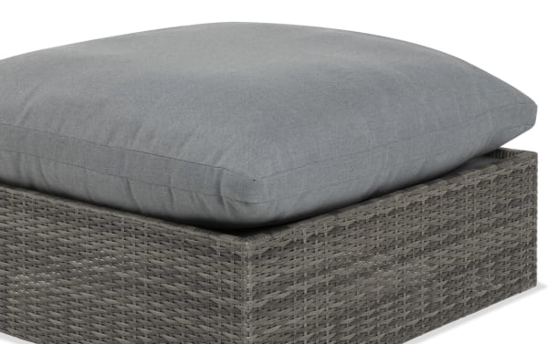 Dream Gray Wicker Outdoor Ottoman from Dream Outdoor collection with gray all-weather wicker, aluminum frame, and reversible gray polyester cushion.