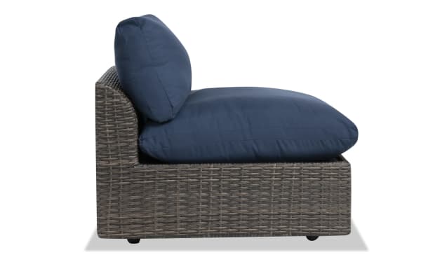 Dream Navy & Brown Wicker Outdoor Armless Chair from Dream Outdoor collection, featuring navy polyester cushions on a brown all-weather wicker aluminum frame, transitional style, modular deep seating with reversible, zippered cushions for easy cleaning.