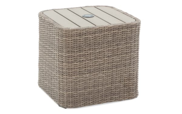 Square outdoor side table with light gray synthetic wicker base and beige wood-look slatted top, featuring a central umbrella hole.