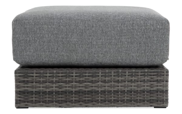 Modular Bob® Gray Wicker Outdoor Ottoman with gray all-weather wicker base, rust-proof aluminum frame, and plush polyester cushion, transitional style.