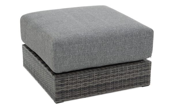 Modular Bob® Gray Wicker Outdoor Ottoman with gray polyester cushion, all-weather wicker base, and rust-proof aluminum frame in transitional style.