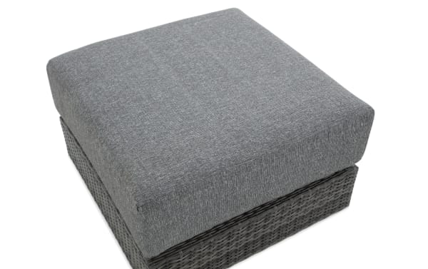Gray wicker outdoor ottoman from the Modular Bob® collection, featuring all-weather wicker, aluminum frame, and a plush polyester cushion with memory foam.