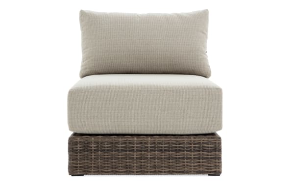 Modular Bob® Beige & Brown Wicker Outdoor Armless Chair with beige polyester cushions, all-weather wicker base, and rust-proof aluminum frame in transitional style.
