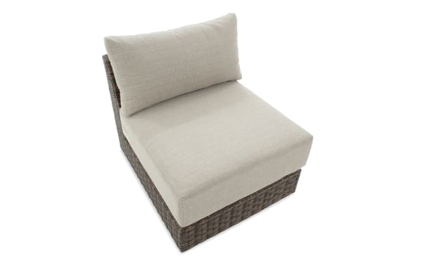 Beige Modular Bob® Transitional outdoor armless chair with brown all-weather wicker base, rust-proof aluminum frame, and polyester fabric cushion.