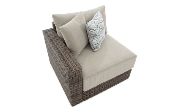 Modular Bob® Beige & Brown Wicker Outdoor Left Arm Chair with rust-proof aluminum frame, all-weather wicker, and beige polyester cushions in transitional style.