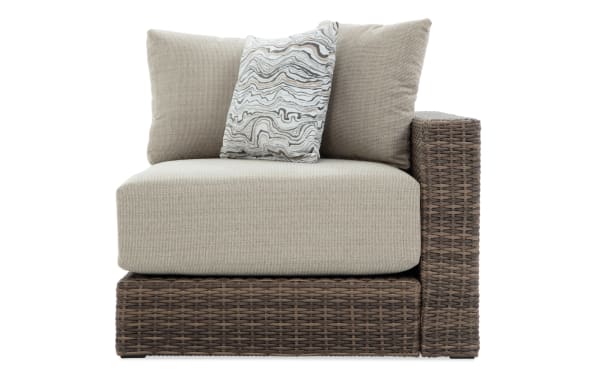 Modular Bob® Beige & Brown Wicker Outdoor Right Arm Facing Chair with beige polyester cushions, all-weather wicker, and rust-proof aluminum frame, transitional style.
