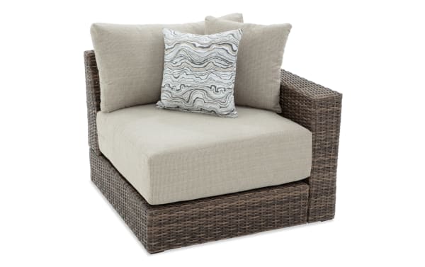 Beige Modular Bob® Outdoor right arm chair with brown all-weather wicker frame, rust-proof aluminum, and plush polyester cushions in transitional style.