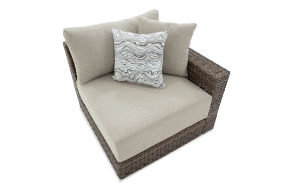 Beige Modular Bob® outdoor right arm facing chair with brown all-weather wicker frame, plush polyester cushions, and transitional style.