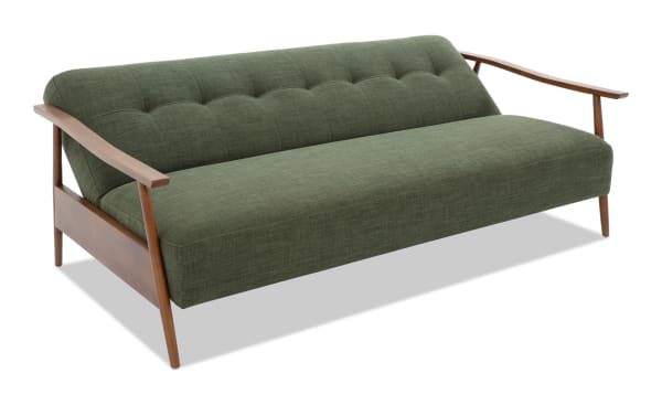 Mid-century modern Bettie Avocado Futon with tufted polyester fabric upholstery, wooden arms, and frame in green from the Bettie collection.