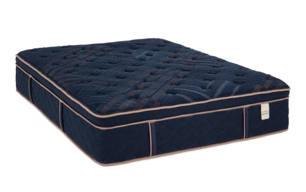 Copper Radiance 14.5'' Queen Plush Boxed Mattress in navy blue with quilted copper-infused cover, plush hybrid design, and memory foam layers.