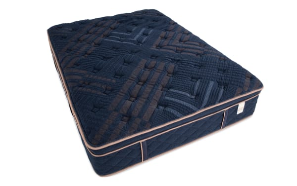 Copper Radiance 14.5'' Queen Plush Boxed Mattress with navy blue copper-infused quilted cover, plush hybrid design, and gel-infused memory foam layers.