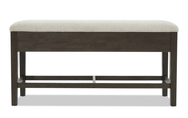 Contemporary Encore Brown & Beige Upholstered Counter Height Dining Bench with polyester fabric, acacia veneer frame, and storage under cushioned seat.