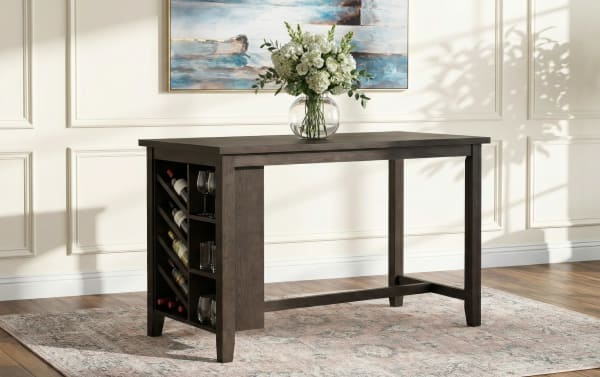 Dark wood kitchen island with built-in wine rack and glassware storage, featuring a rectangular top and floral centerpiece in a glass vase.