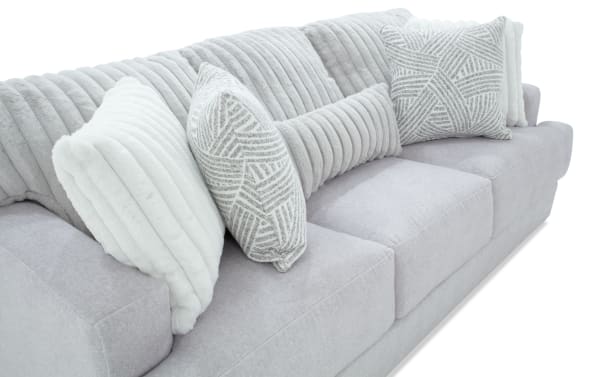 Contemporary Sofia Gray 93'' Sofa with gray polyester fabric upholstery, channel tufted back cushions, and matching accent pillows for luxury and comfort.